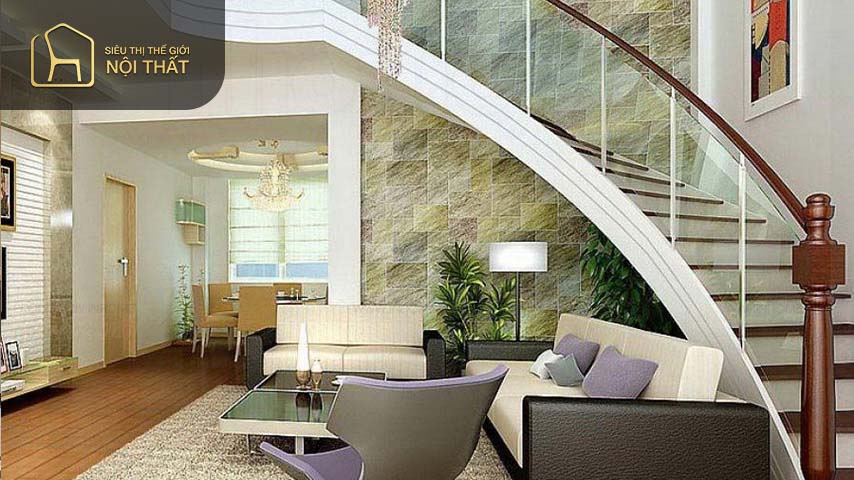 Cầu thang phòng khách có tay vịn bằng gỗ kết hợp với kính cường lực tạo không gian ấn tượng cho căn phòng